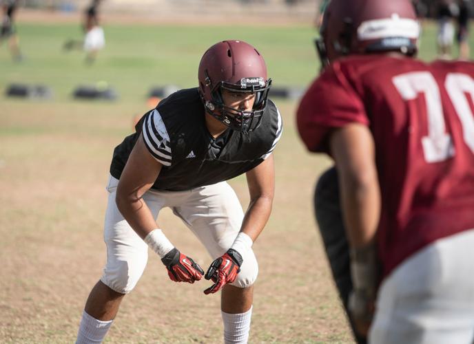 Walden Grove LB Rick Avelar goes through defensive drills durin