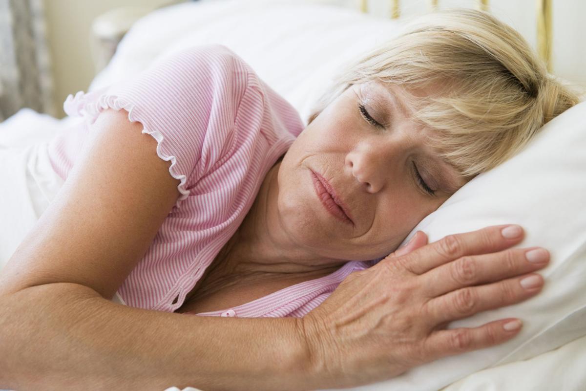Woman lying in bed sleeping