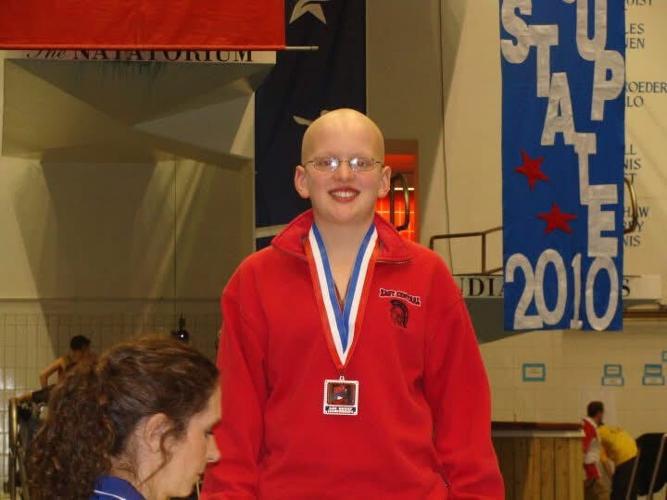 It used to be common practice for the best swimmers to go bald to reduce drag in the water. Grant House started shaving his head for championship meets when he was just 6. He was 12 in this 2010 picture at IU-Indianapolis, where he'll compete in June as a