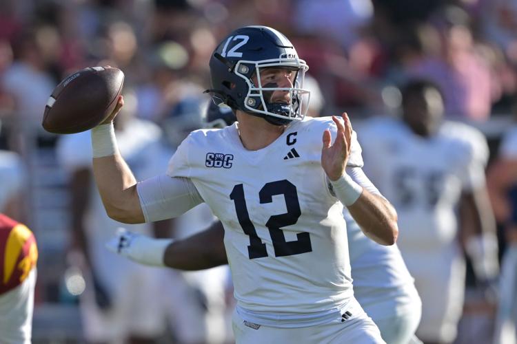 Georgia Southern Eagles quarterback JC French IV (12) throws a pass during the first half against the USC Trojans at United Airlines Field at Los Angeles Memorial Coliseum Los Angeles, California.