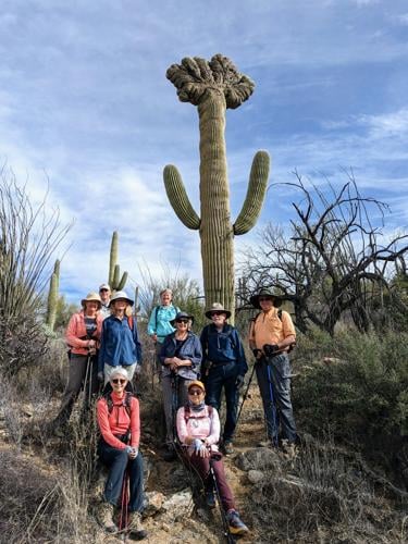 2023-02-22-Hikers-Pose-by-a-Crested-Saguaro.jpeg
