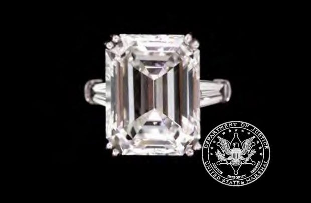 Ring brings in $550,000 at auction to benefit schemer Madoff's victims   