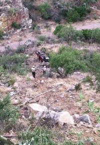 Driver arrested in crash off cliff that kills 2 near Tucson