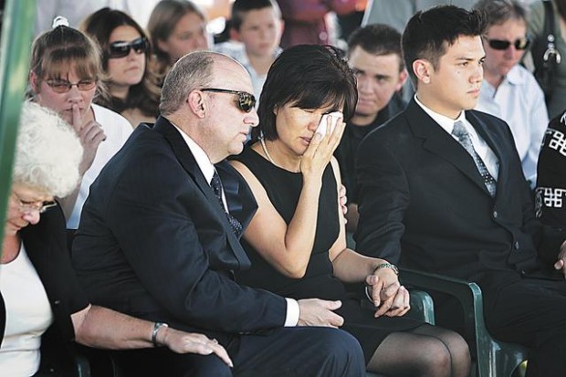 Woman who died in flash flood is OK in heaven, mourners told  