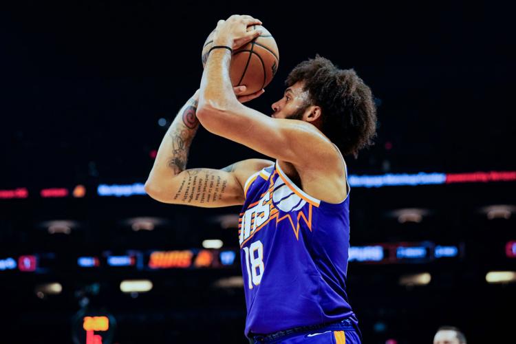 Phoenix Suns forward Isaiah Livers (18) makes a three-point shot in the first half of the game at Mortgage Match Up Center in Phoenix on Nov. 23, 2025.