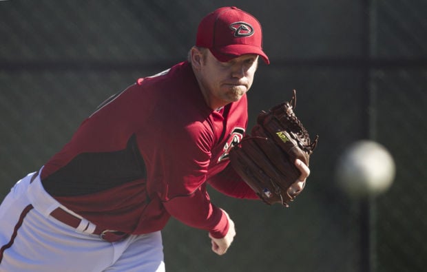 Baseball notebook: D-backs lock up closer Putz; Oakland rewards Melvin    