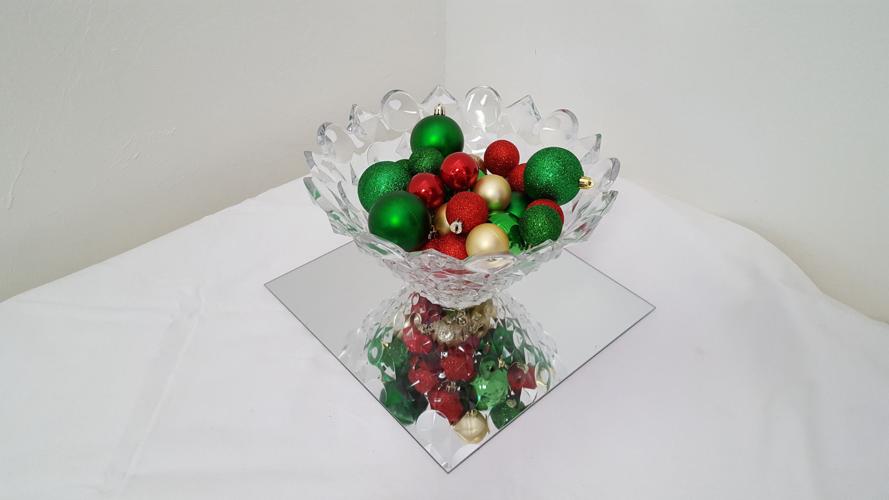 DIY holiday decorating Christmas ornaments in a glass bowl