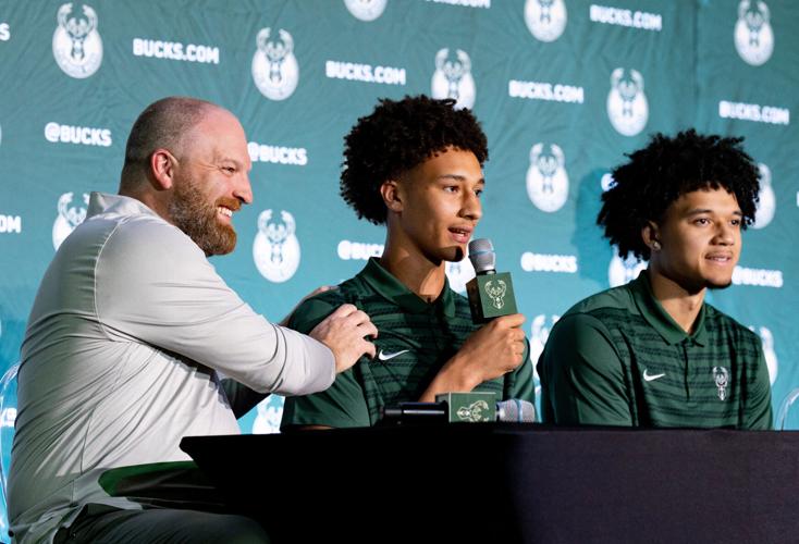 Milwaukee Bucks first-round draft pick Nate Ament answers questions while surronded by coach Taylor Jenkins, left, and Brayden Burries during an event June 25 at the Pieper-Hillside Boys & Girls Club.