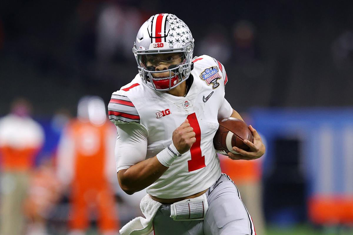 Ohio State quarterback Justin Fields runs with the ball in the first half against Clemson during the College Football Playoff semifinal game at the Allstate Sugar Bowl at Mercedes-Benz Superdome in New Orleans on Jan. 1, 2021.