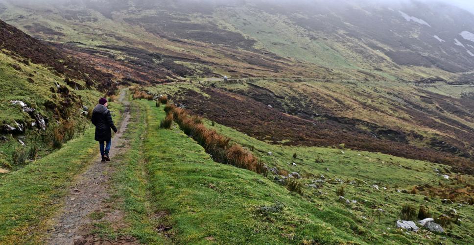 The writer's wife, Mary Carpenter, walks along the Pilgrims Path near Teelin in County Donegal. The West Coast of Ireland is best explored on foot.