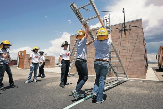Girls learn firefighting skills at fire camp  