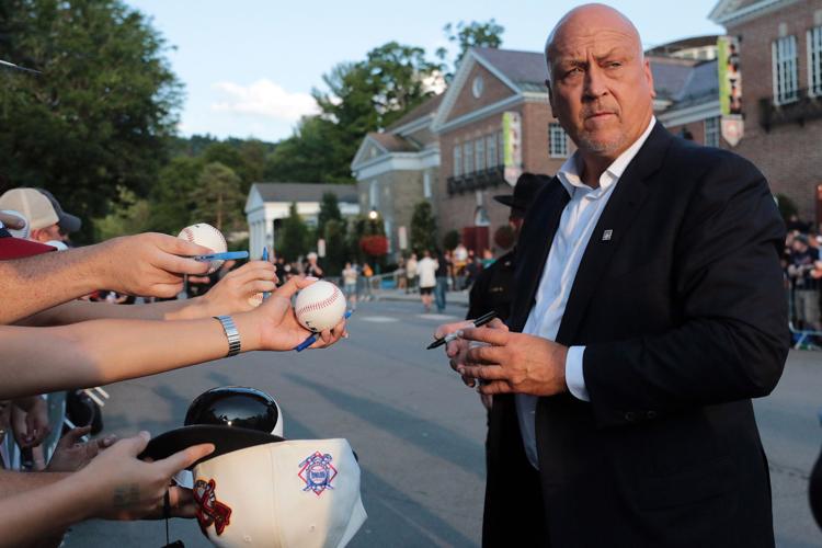 Cal Ripken Jr. signs autographs during the Hall of Fame Parade of Legends during Hall of Fame Weekend in Cooperstown N.Y. on Saturday, July 28, 2018.