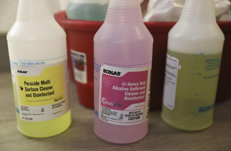 Housekeepers use a variety of cleaning products at The St. Clair Hotel, 162 E. Ontario St.