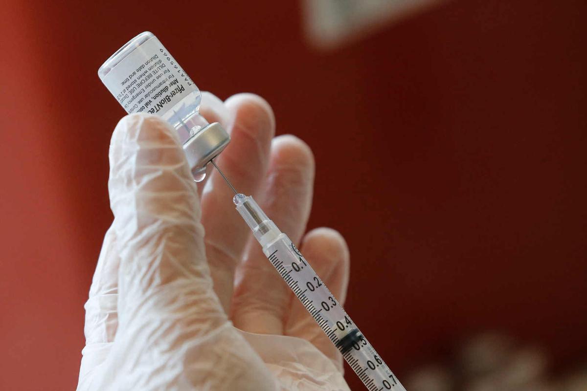 Masked and mostly vaxxed, college students return to in-person classes