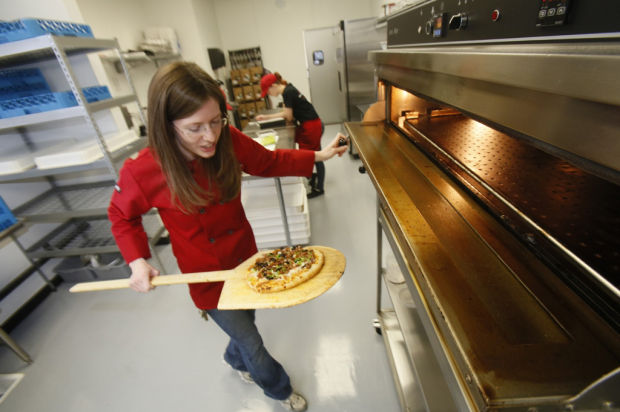 Pac-Man meets pepperoni at game-play pizza shop    