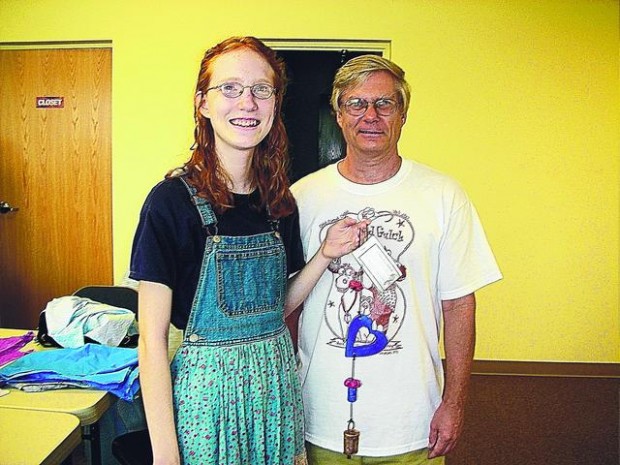 Teen's sewing circle works to aid needy  