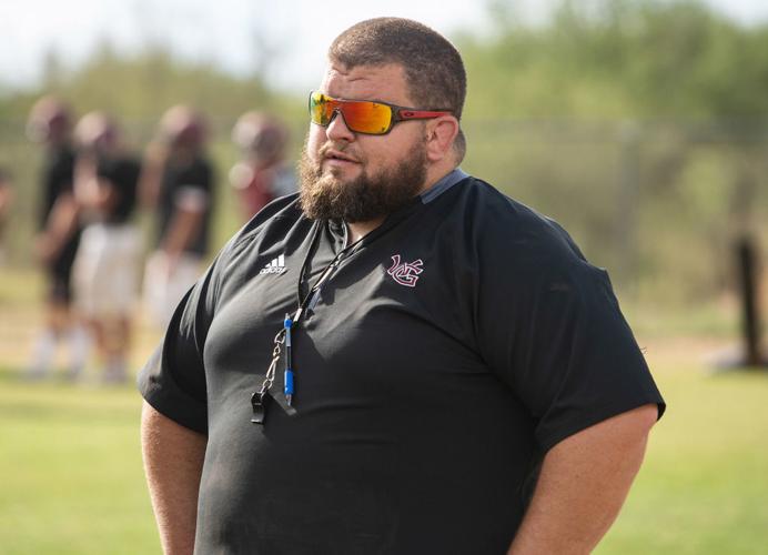 Walden Grove Coach Corey Noble directs his team's practice from