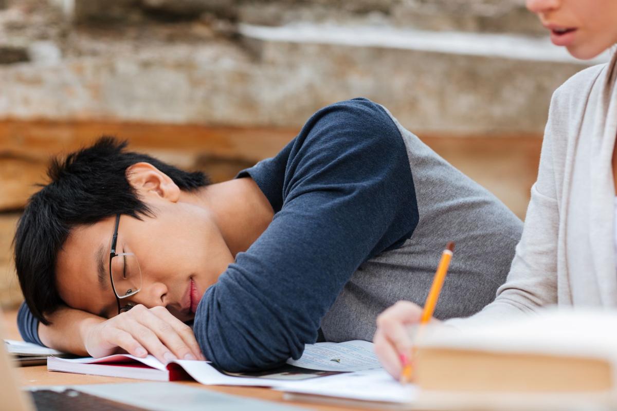 man in glasses sleeping on the lesson