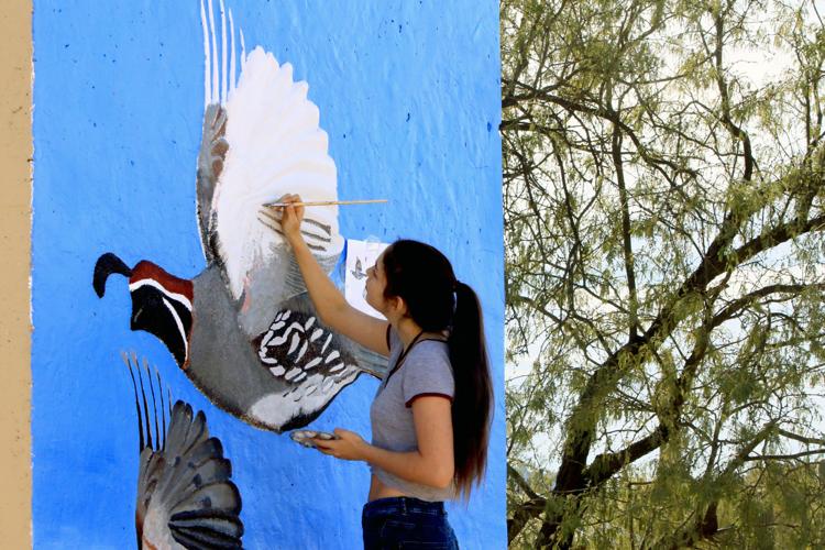 City High students paint memorial