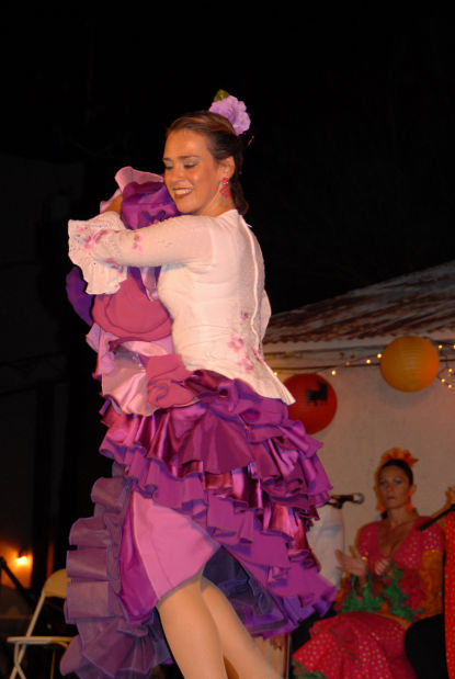 Rebecca Thomas dances in a pink dress at the 2012 Tucson Flamenco Festival