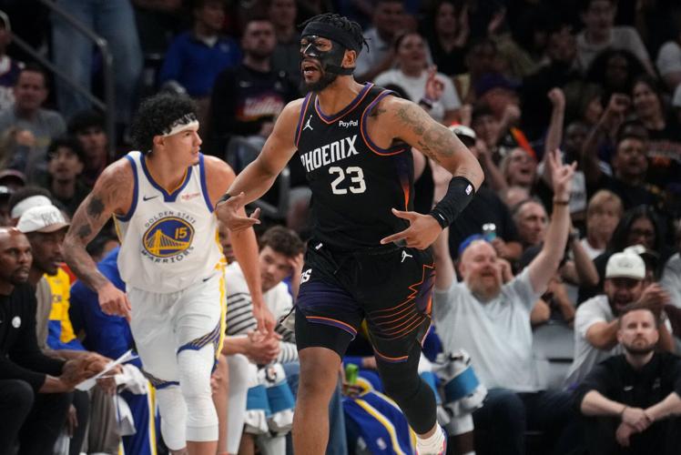 Phoenix Suns guard Jordan Goodwin (23) celebrates his made 3-pointer against the Golden State Warriors during their play-in tournament game at Mortgage Matchup Center in Phoenix on April 17, 2026.