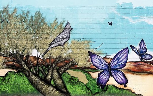 Downtown wall that stirred furor redone with less-strident imagery  