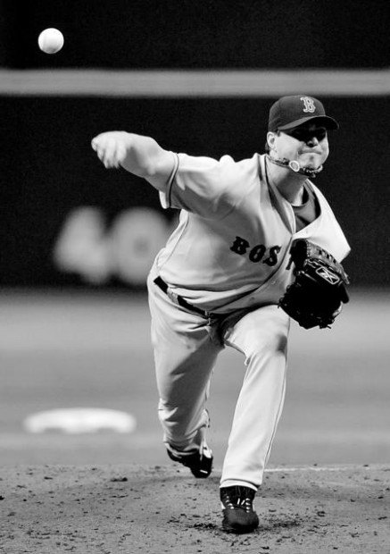 Tampa Bay Rays Manager Joe Maddon leaves the field after the Rays defeated  the Boston Red Sox 3-1 to win the American League Championship at Tropicana  Field in St. Petersburg, Florida on