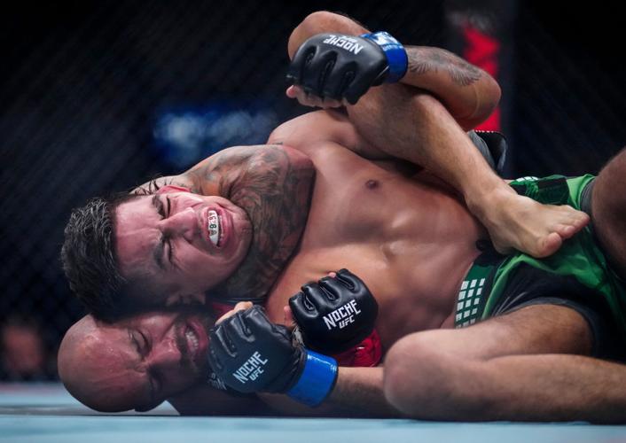 Jean Silva uses a chokehold to force a tap-out from Jose Miguel Delgado during Noche UFC at Desert Diamond Arena in Glendale, on