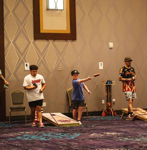Young cornhole players