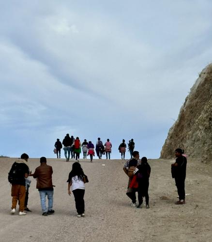 Asylum seekers cresting hill