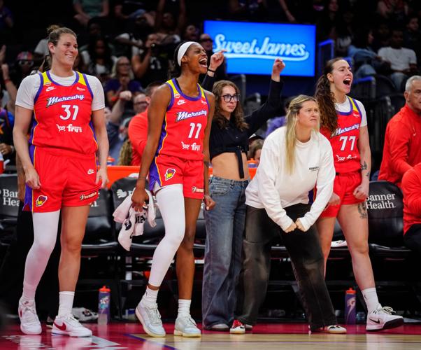 Mercury forward Valeriane Ayayi (11) celebrates with her teammates on the bench during a game against the Storm at the Mortgage Matchup Center in Phoenix, on July 2, 2026.