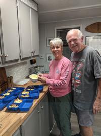 Preparing meals for neighbors gets couple belled