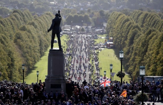 Protestant march produces no violence in colorful reminder of Ulster divisions    