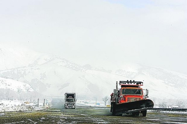 Vehicles led through snowy pass  