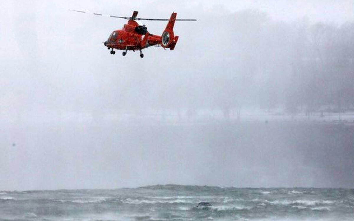 car in water at falls