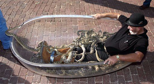 'Texas Snake Man' sits in tub with 87 rattlers  