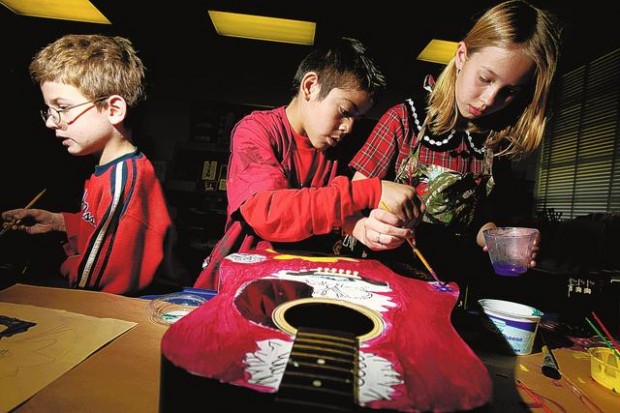 Students' guitar art has bright, charitable tone  