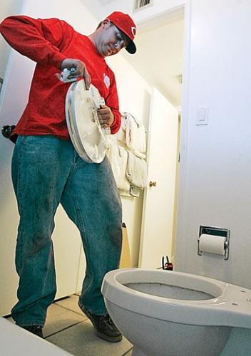 Rebate spurs many to yank old toilets  