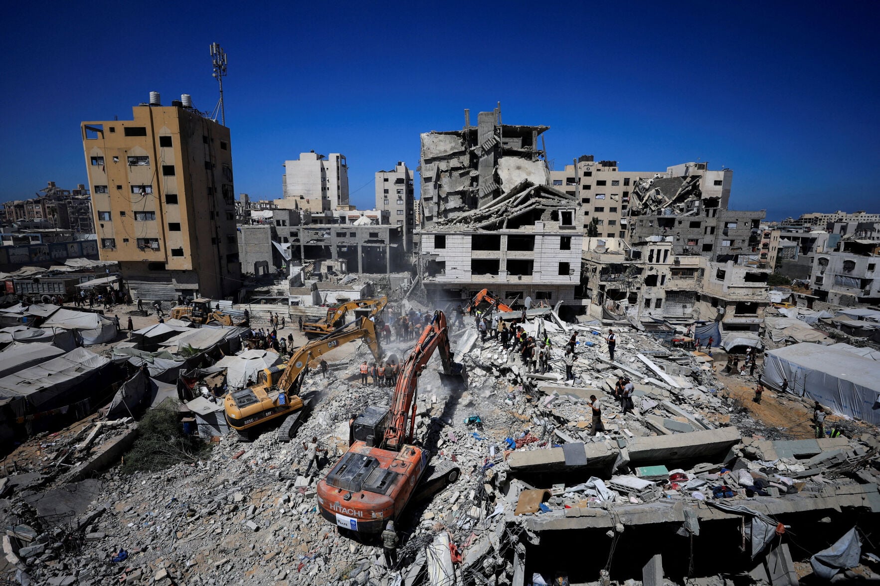 War-damaged Gaza building collapses, killing 20