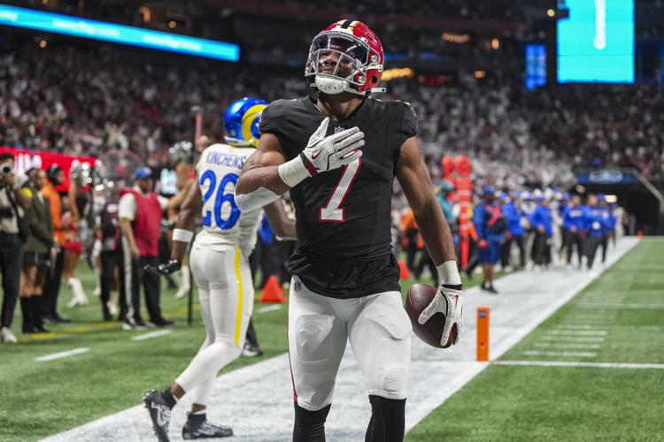 Dec 29, 2025; Atlanta, Georgia, USA; Atlanta Falcons running back Bijan Robinson (7) reacts after catching a touchdown pass against the Los Angeles Rams during the first quarter at Mercedes-Benz Stadium. Mandatory Credit: Dale Zanine-Imagn Images