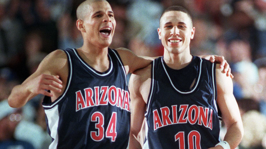 Stars of Arizona’s 1997 title team celebrate during replay of national