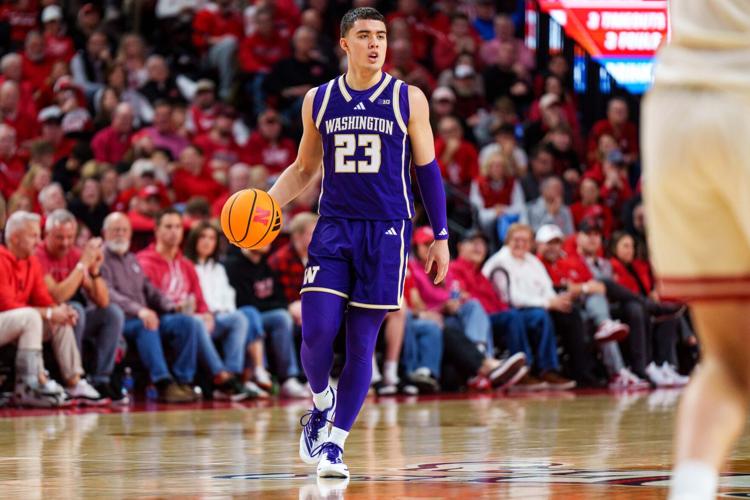 Jan 21, 2026; Lincoln, Nebraska, USA; Washington Huskies guard JJ Mandaquit (23) dribbles during the second half against the Nebraska Cornhuskers at Pinnacle Bank Arena. Mandatory Credit: Dylan Widger-Imagn Images