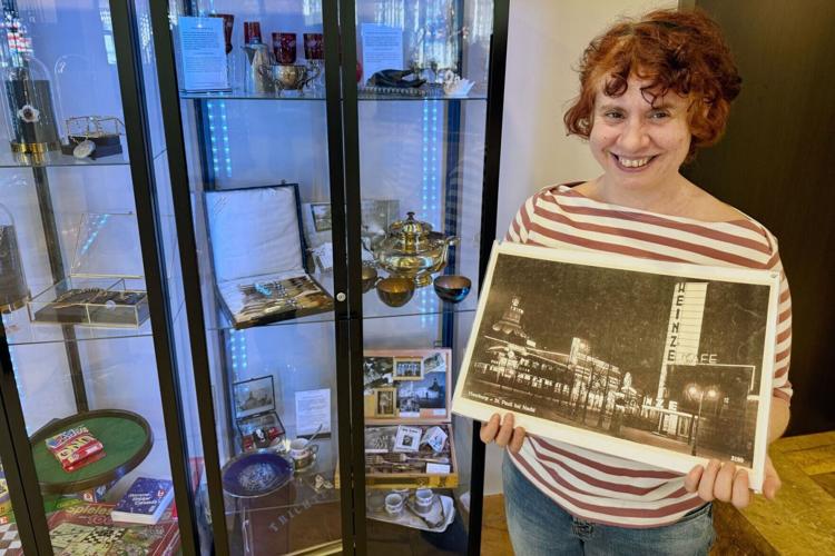 Historian Eva Decker holds a picture of the Trichter.