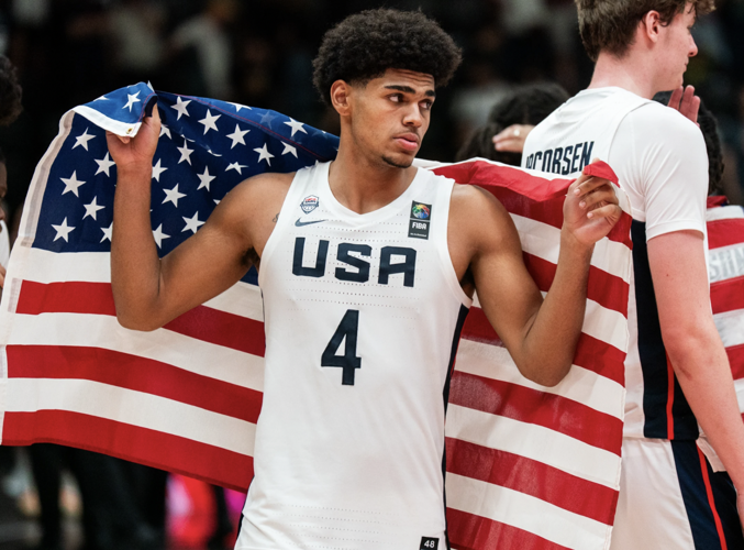 Koa Peat American flag after U19 World Cup championship