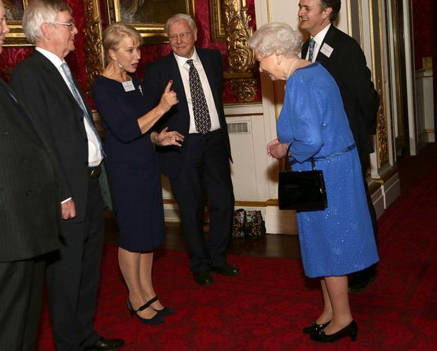 Queen Elizabeth II, right, meets actress Dame Helen Mirren during the Dramatic Arts reception at Buckingham Palace on Feb. 17, 2014, in London.