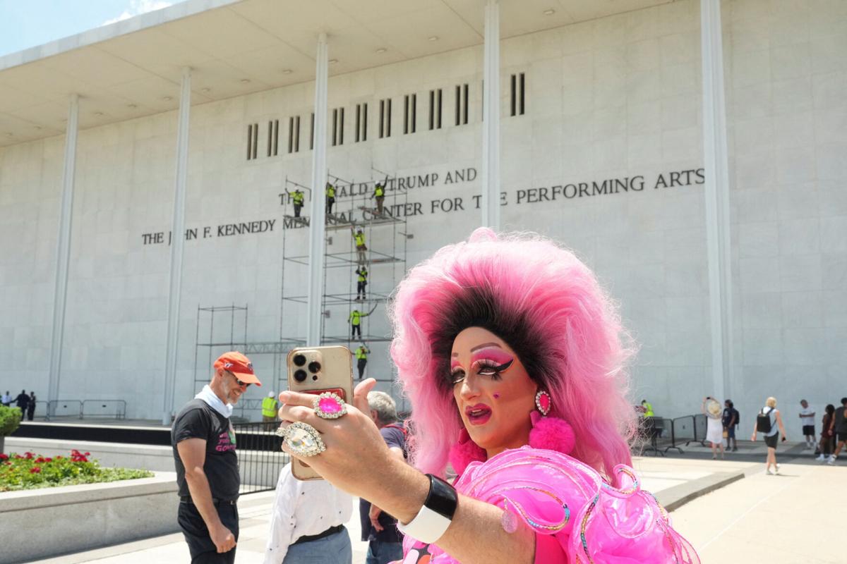 Lettering referencing U.S. President Donald Trump is removed from the facade of the John F. Kennedy Center for the Performing Arts, in Washington