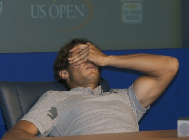 Nadal succumbs to cramps, not foe, on muggy Sunday   