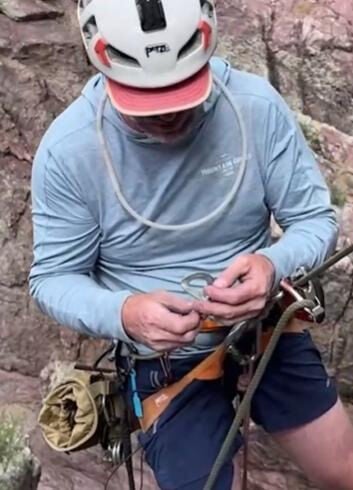 Climber Aaron Collins installs anchors along a new rock climbing route in Arizona. Collins is one of a few dozen volunteers working to expand Arizona's rock climbing opportunities.