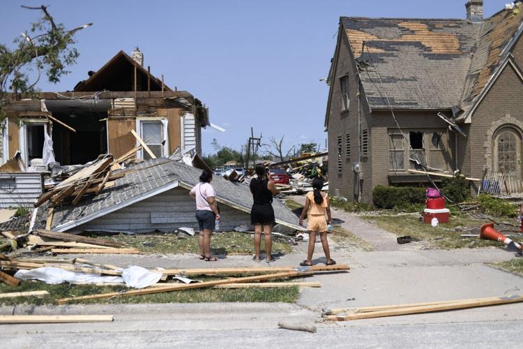 Residents inspect the damage amid debris and destroyed homes a day after a tornado ripped through Menasha, Wisconsin, on Tuesday, July 28, 2026.