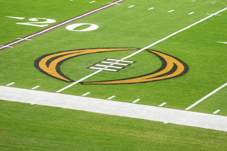 The College Football Playoff logo on the field at State Farm Stadium, the site of the 2022 CFP Semifinal between the TCU Horned Frogs and the Michigan Wolverines.